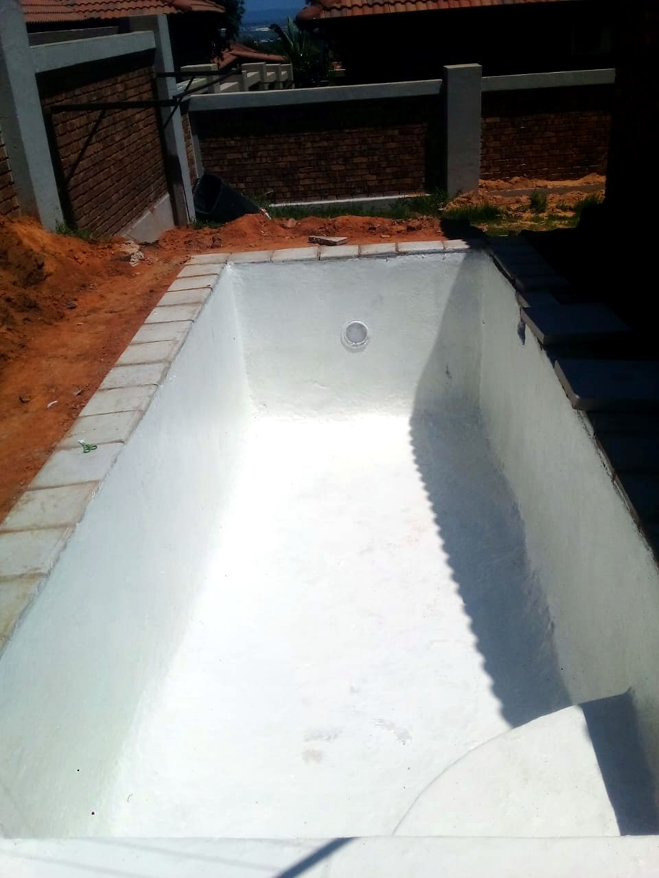 Pool shell freshly lined with white fibreglass